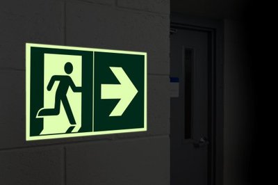 Brady safety signs with photoluminescent pictograms and tapes